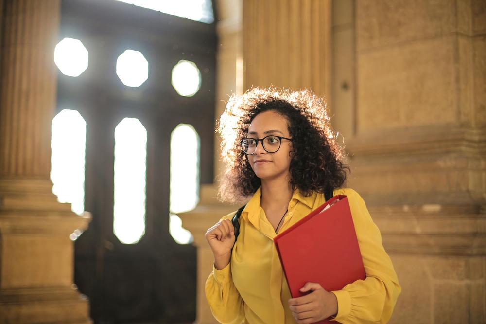 Student Girl Holding Red Book Binder